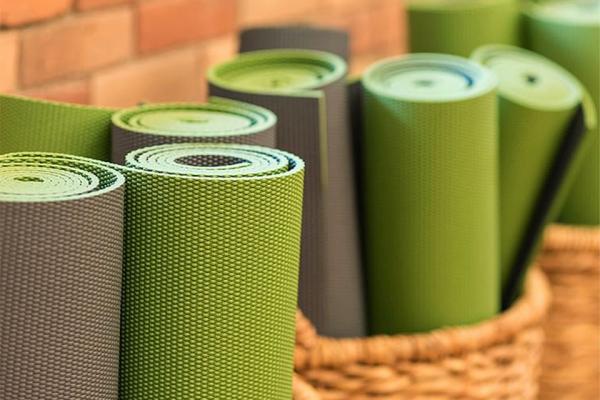 Green and Grey yoga mats in baskets