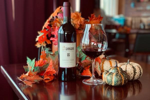 Damiani Cabernet Franc on a fall decorated table.