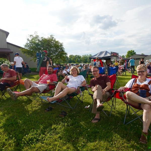 customers relaxing in camp chairs at a concert at Deer Run Winery